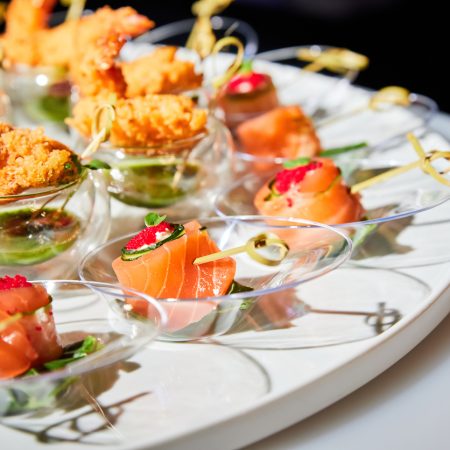 Set of various small appetizers on a buffet table